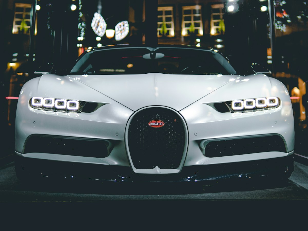 White Bugatti photographed head-on at night